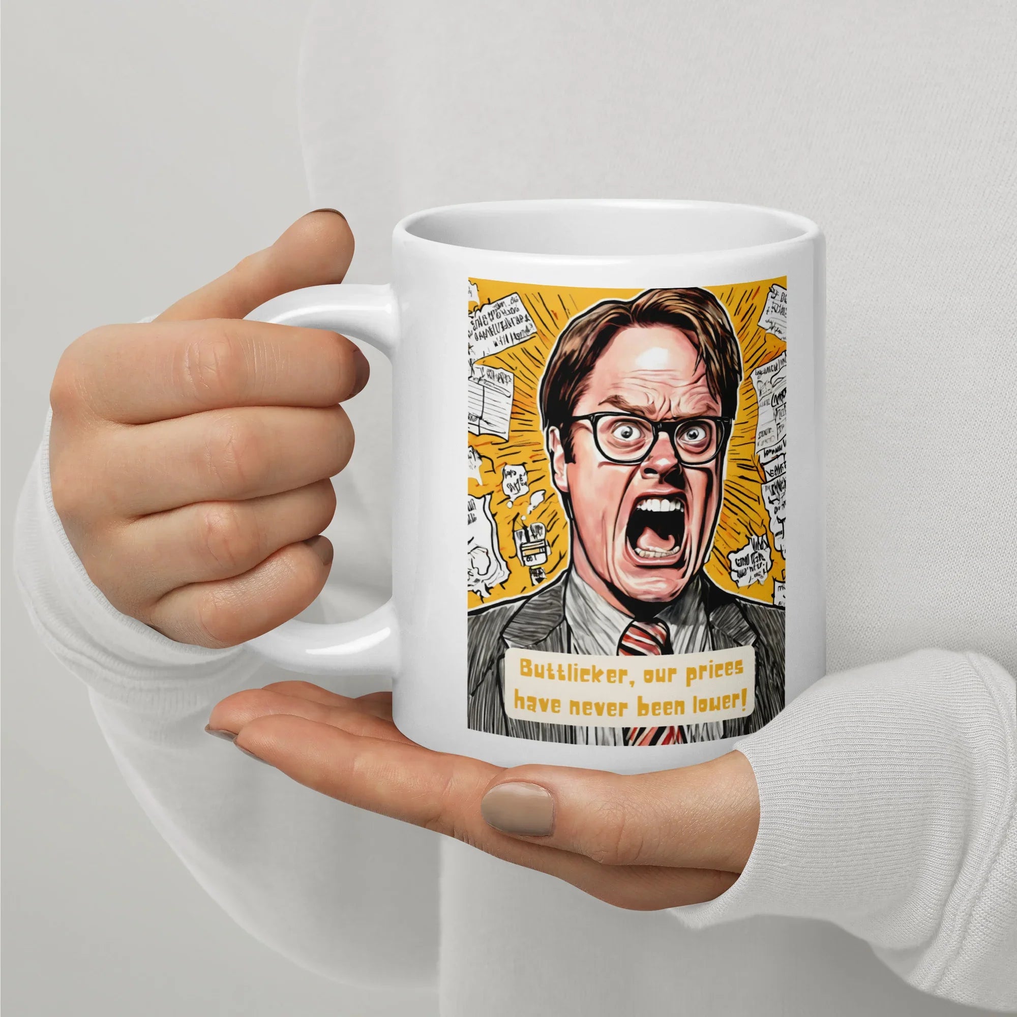 White glossy 20 oz mug with angry man illustration and text about low prices, held in hand